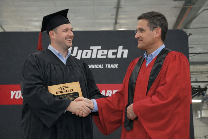 Mike Tenuto receiving his plumbing technology diploma at WyoTech graduation ceremony