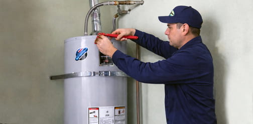 Plumber repairing water heater in Brentwood CA